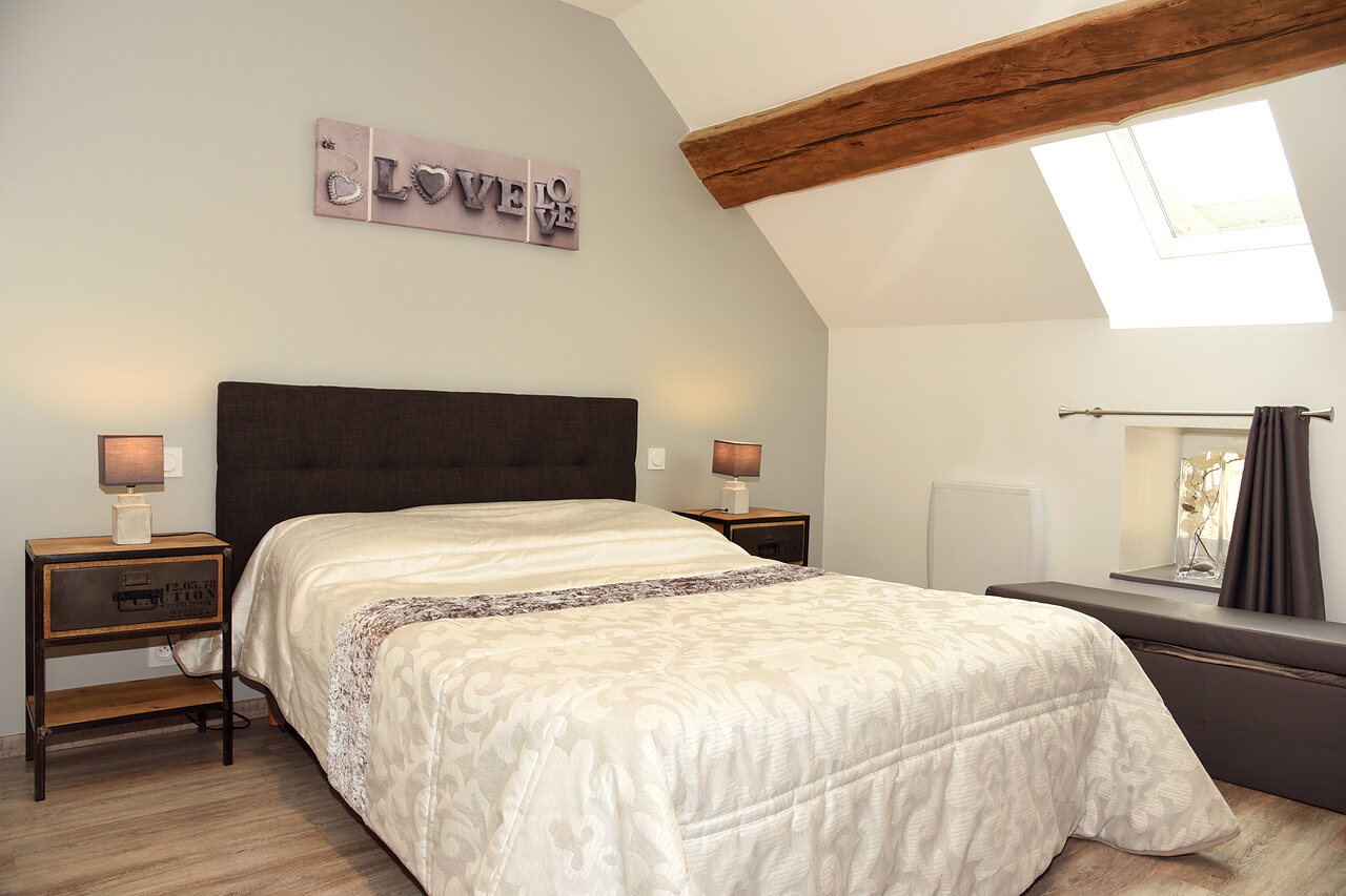 The bedroom and its double bed