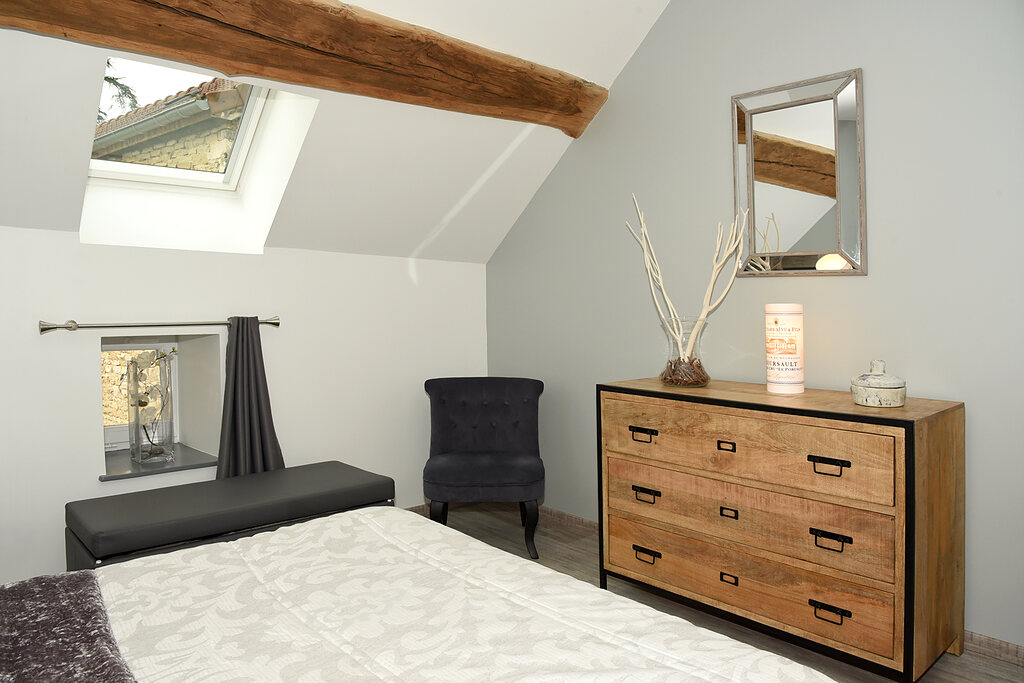 The chest of drawers and the armchair