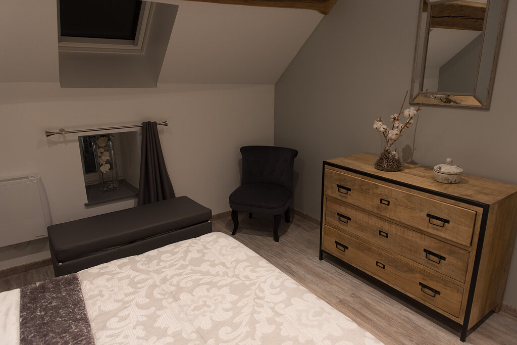 La chambre sous les poutres