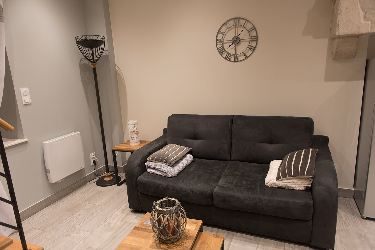 The sofa bed and the armchairs